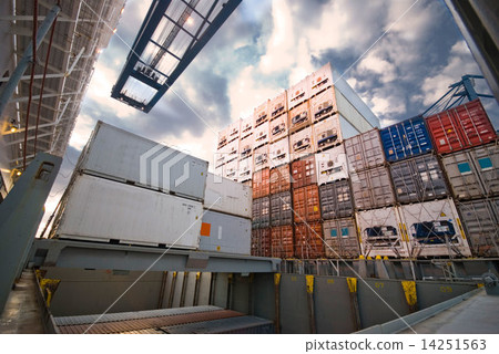 Container Cargo operation in busy Port Terminal with Ship moored alongside 14251563