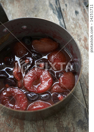 poached prunes and cherries in pot 14251711