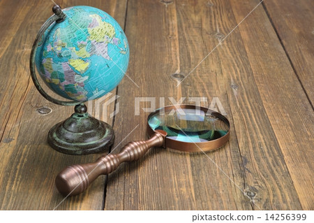Vintage Globe Map and Magnifying Glass 14256399