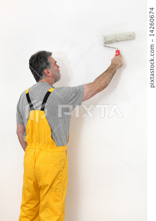 Worker painting  in a room, home renovation 14260674