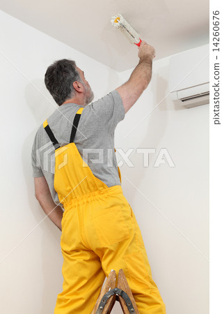 Worker painting  in a room, home renovation 14260676