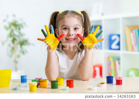 cute kid girl with hands painted in colorful paints cute kid girl with hands painted in colorful paints 14263163