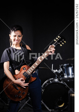 Woman guitar player during concert 14267282