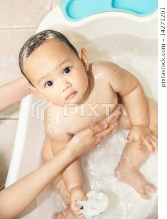 Baby bathing in the tub Baby bathing in the tub 14271201