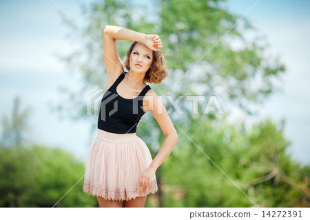 Sexy young woman posing outdoors 14272391