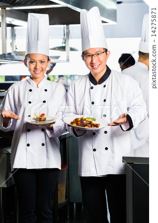 Asian Chef in restaurant kitchen cooking 14275871