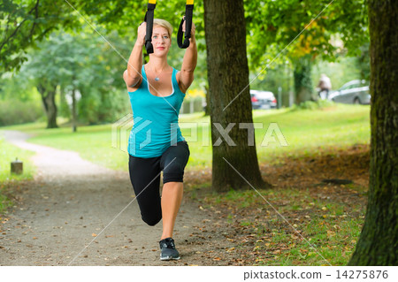 woman doing suspension sling trainer sport 14275876