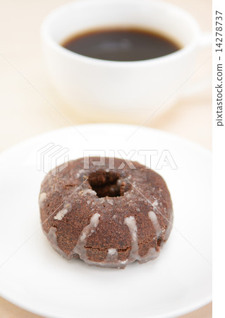 Delicious chocolate donut and coffee Delicious chocolate donut and coffee 14278737