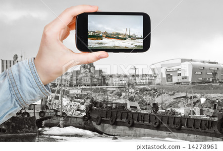 tourist taking photo of Anadyr harbor in winter 14278961