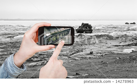 tourist taking photo tracked vehicle on ice road 14278963