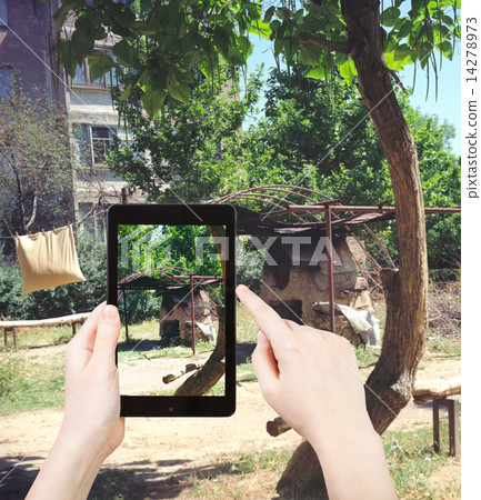 tourist taking photo tandoor stove in urban yard tourist taking photo tandoor stove in urban yard 14278973
