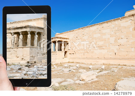 tourist taking photo of monument at acropolis 14278979