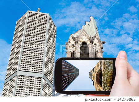 tourist taking photo of gedachtniskirche in Berlin 14279862