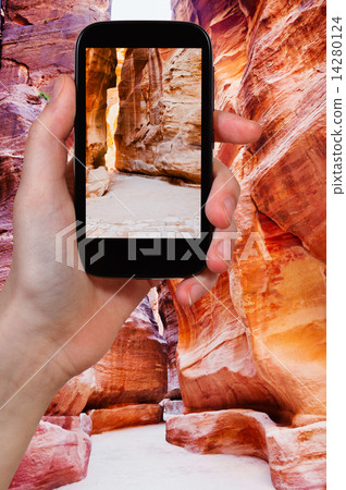 tourist taking photo of The Siq in city Petra 14280124