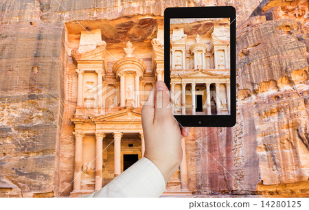 tourist taking photo of Treasury Monument in Petra tourist taking photo of Treasury Monument in Petra 14280125