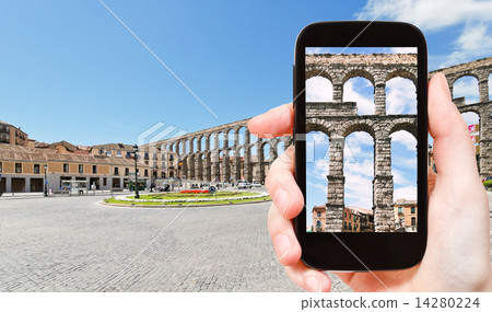 tourist taking photo ancient Aqueduct of Segovia 14280224