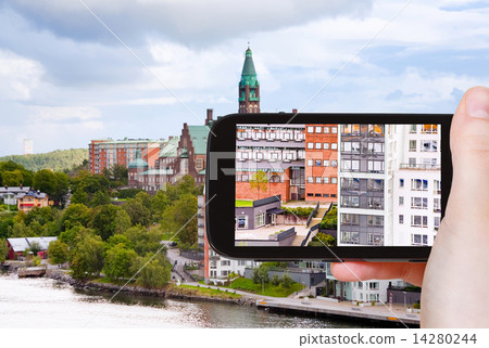 tourist taking photo of houses in Stockholm tourist taking photo of houses in Stockholm 14280244