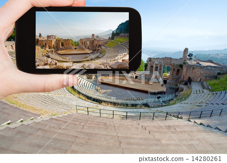 tourist taking photo of ancient amphitheater tourist taking photo of ancient amphitheater 14280261