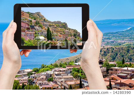 tourist taking photo city Taormina 14280390