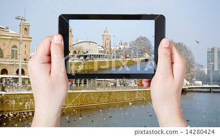 tourist taking photo of waterfront in Zurich tourist taking photo of waterfront in Zurich 14280424