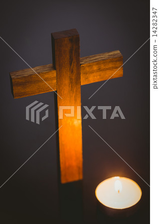 Candle and wooden cross 14282347
