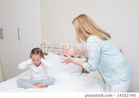 Upset mother scolding her daughter Upset mother scolding her daughter 14282740