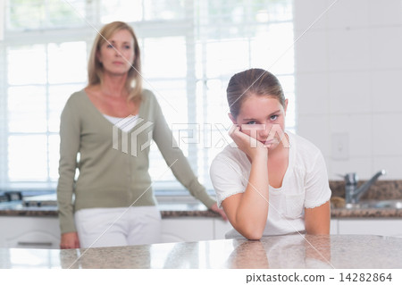 Little girl sulking after am argument with her mother 14282864