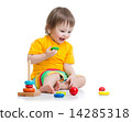 baby playing with pyramid toy 14285318