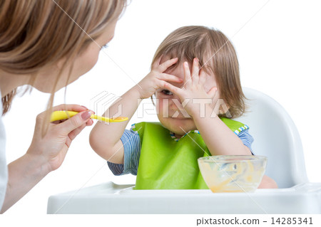 Child boy refuses to eat closing face by hands 14285341