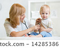 doctor woman examining heartbeat of kid boy with stethoscope 14285386