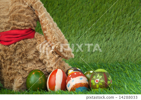 Rabbit, sit on green grass and group of colorful eggs are behind Rabbit, sit on green grass and group of colorful eggs are behind 14288033