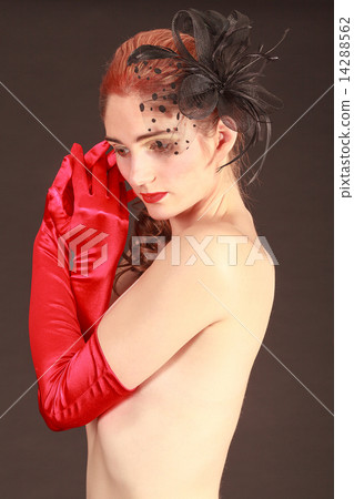 Young dreamy woman with bare breasts covered 14288562