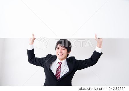 A businessman with a white board 14289311