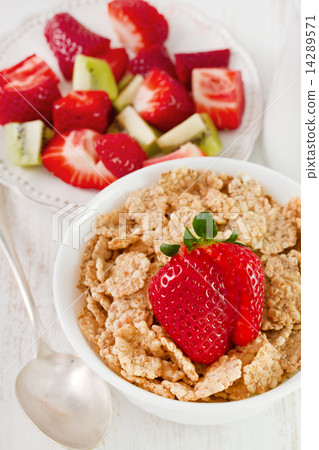 cereals with strawberry in white bowl cereals with strawberry in white bowl 14289571