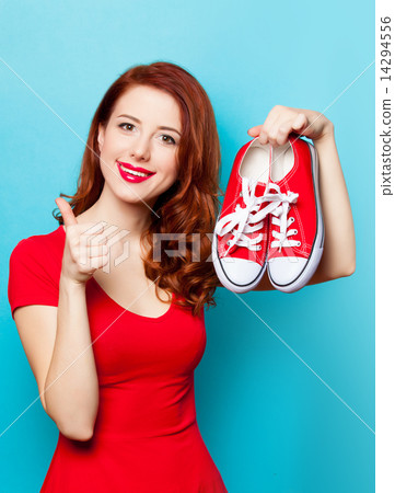 Smiling redhead girl with gumshoes 14294556