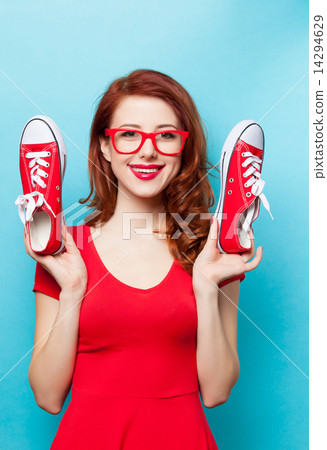 Smiling redhead girl with gumshoes 14294629
