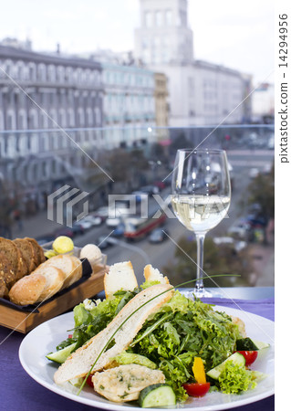 salad with cheese and arugula in a restaurant 14294956