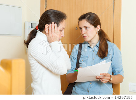 businesswoman trying to collect arrearages from woman 14297195