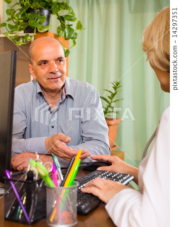Elderly man with doctor in clinic Elderly man with doctor in clinic 14297351