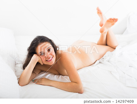 Nude girl on bed at bedroom Nude girl on bed at bedroom 14297409
