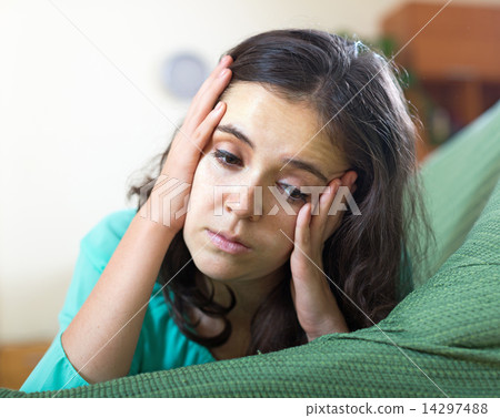 lonely woman crying on the couch lonely woman crying on the couch 14297488