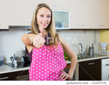Girl showing thumbs up 14297576