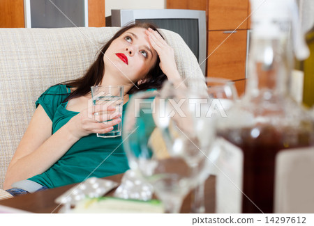 Suffering woman with glass Suffering woman with glass 14297612