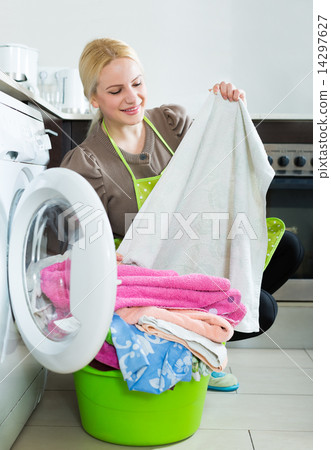 Woman and washing machine 14297627