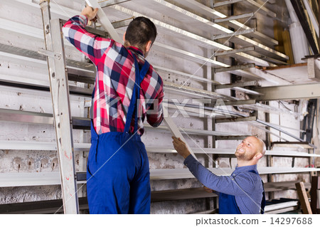 workmen inspecting window frames 14297688