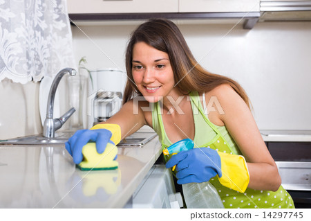 Woman cleaning kitchen 14297745