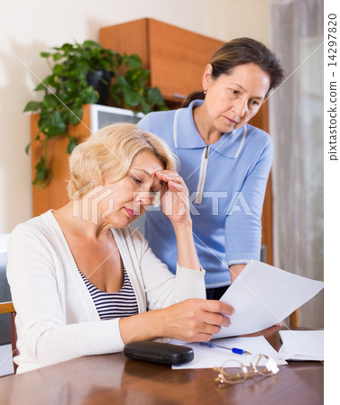 Upset pensioners with documents 14297820