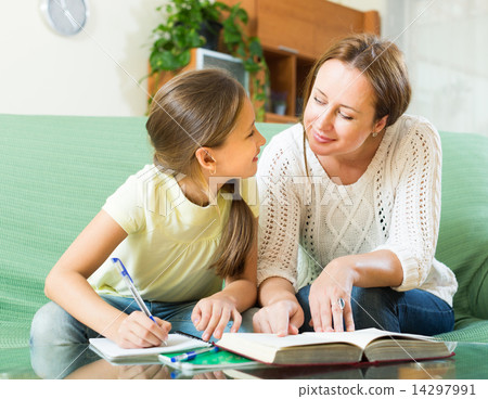 Mother with daughter doing homework Mother with daughter doing homework 14297991
