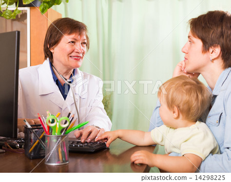 Doctor examining baby 14298225