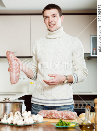 Ordinary guy cooking meat 14298471
